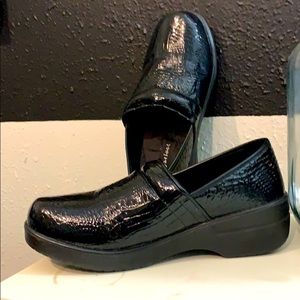 Black snake print slip on shoes